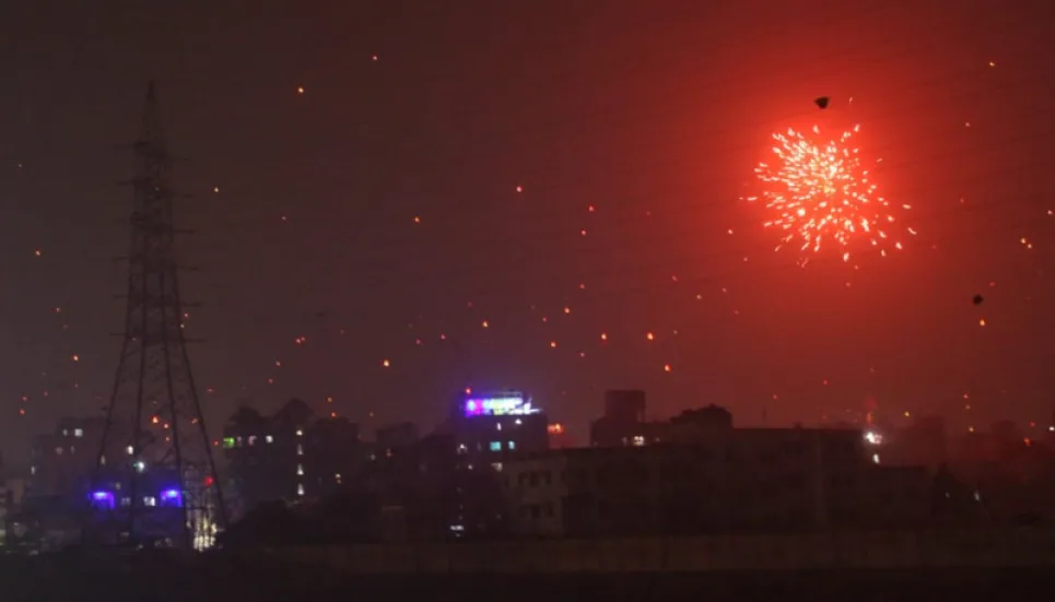 People remain indoors as fireworks light sky to usher in New Year