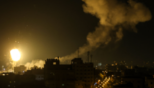 Israel, Gaza militants trade missiles after deadly raid