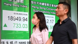 Asian markets turn lower on fresh rate hike worries