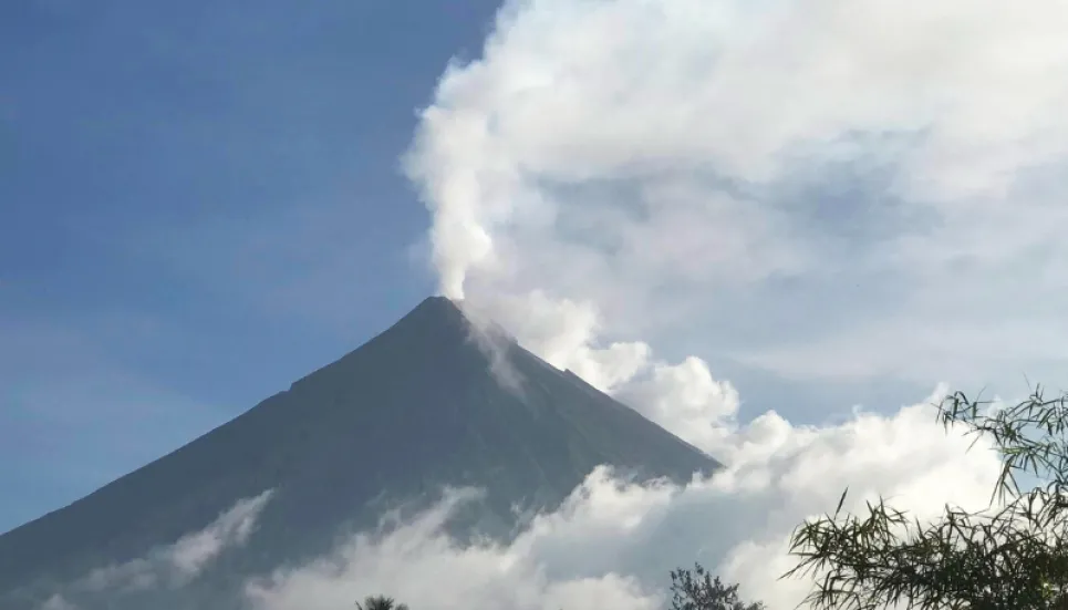 Philippines on alert as volcano spews ash