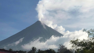 Thousands evacuated as Philippine volcano spews ash, rocks