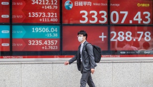 Asian markets mostly up as traders eye China stimulus
