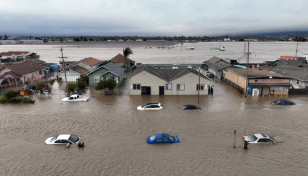 Latest California storm leaves at least two dead, breaks levee