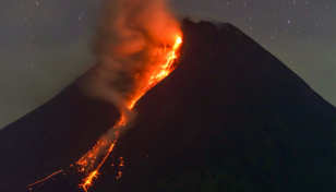 Indonesia's Merapi volcano erupts, spews hot lava