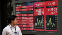 Asian markets struggle as traders prepare for higher rates