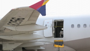 Passenger opens plane door mid-air on Asiana flight