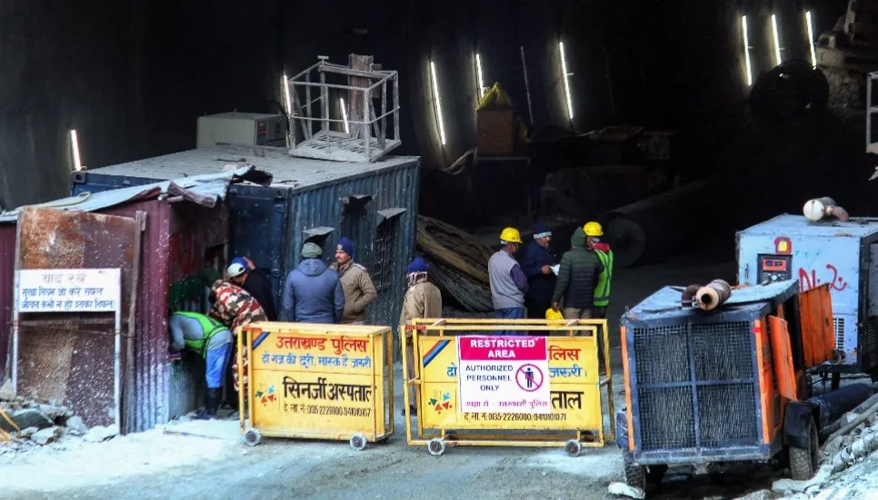 India tunnel rescue efforts paused over fears of cave-in