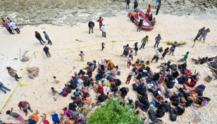 Indonesia moves rejected Rohingya refugees stranded on beach