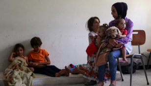 Fleeing Israel strikes, south Lebanon families move into schools