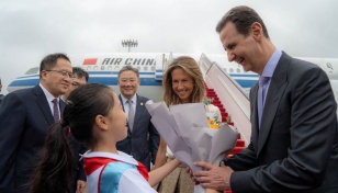 Syria's Assad visits China seeking funds