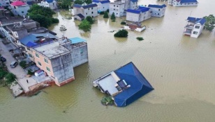 Dam breach triggers floods in central China