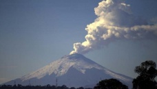 Ecuador volcano rumbles, spews ash cloud
