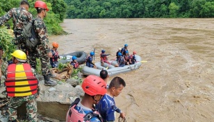 2 buses swept into river by landslide in Nepal