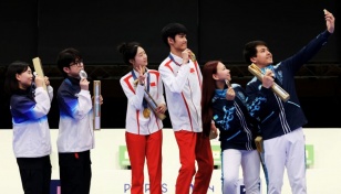 China takes first Olympic gold as rain disrupts Games