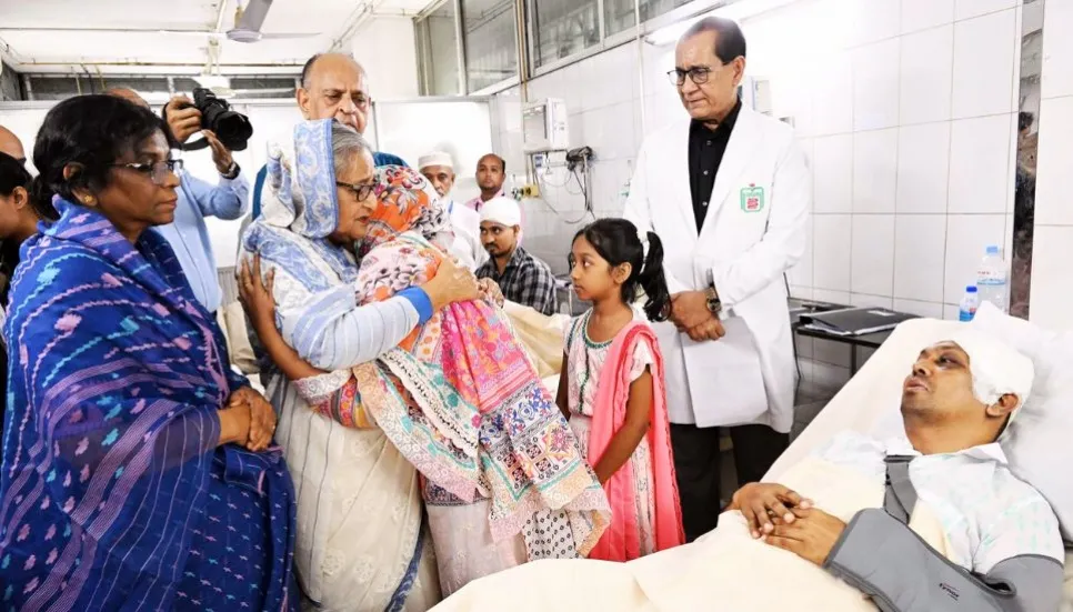 PM visits victims at BSMMU, Police hospital