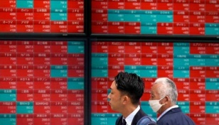 Asian stocks mixed after Wall St, Europe retreat from records