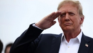 As US remembers fallen soldiers, Trump calls opponents 'scum'