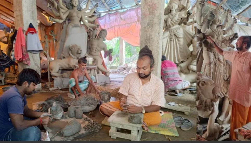 Narayanganj artisans spend busy time making idols for Durga Puja