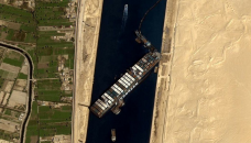 Suez Canal: Effort to refloat wedged container ship continues