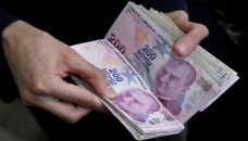 Turkish lira falls 14% after bank governor sacked