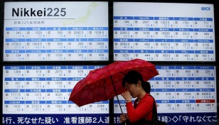 Asia markets take fresh hit as virus surge trumps vaccine hope