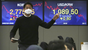 Asian shares decline following lackluster day on Wall Street