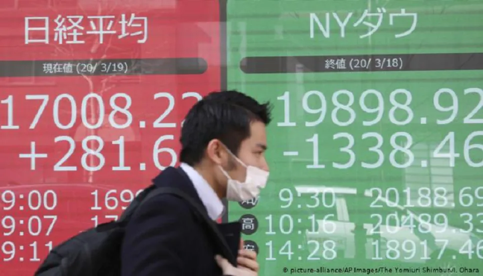 Asian markets mostly down as traders prepare for big week