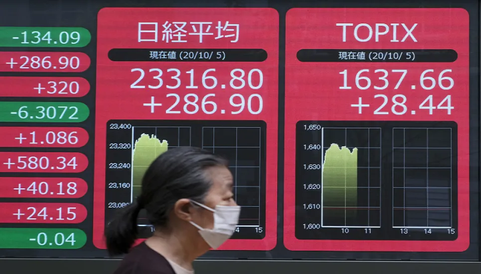 Asian markets rally on Trump health, stimulus hope